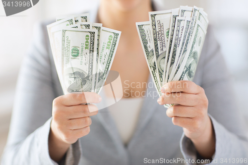 Image of close up of woman hands holding us dollar money