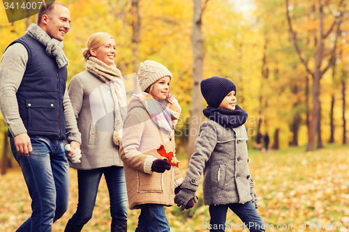 Image of happy family in autumn park