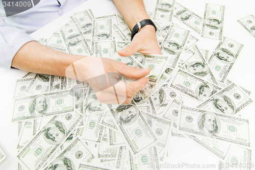 Image of close up of male businessman hands with money