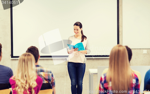 Image of group of smiling students in classroom