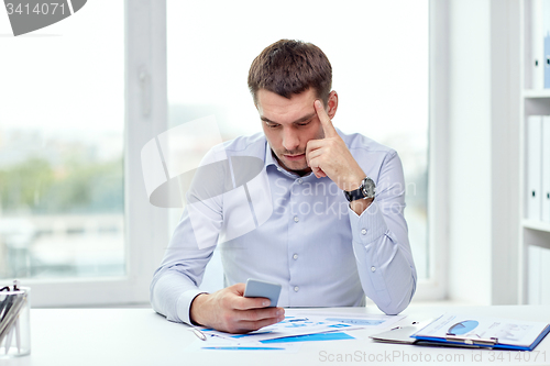 Image of close up of businessman with smartphone