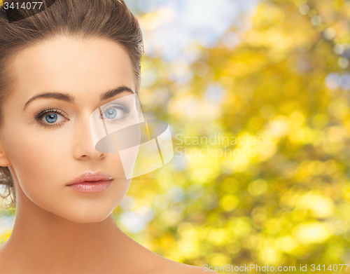 Image of beautiful young woman with bare shoulders