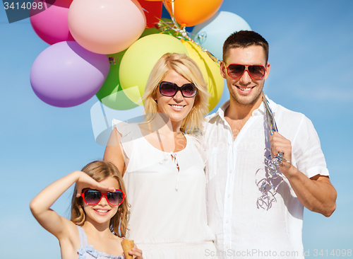 Image of family with colorful balloons