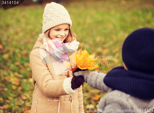 Image of smiling children in autumn park