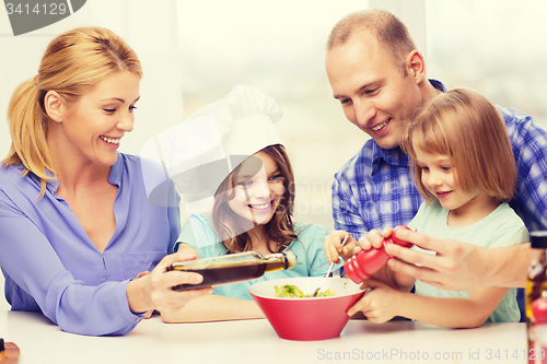 Image of happy family with two kids eating at home