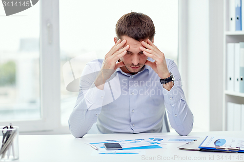 Image of close up of businessman with smartphone