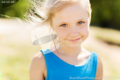 Image of happy little girl outdoors at summer