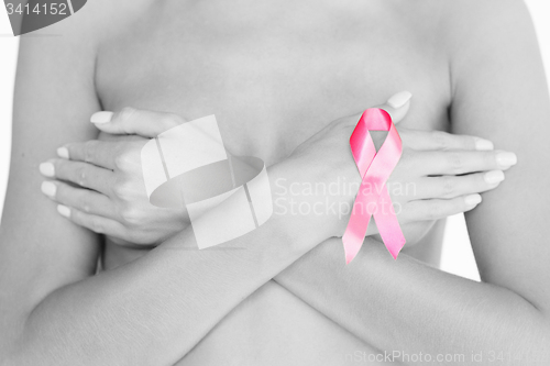 Image of naked woman with breast cancer awareness ribbon