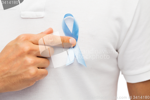 Image of hand with blue prostate cancer awareness ribbon