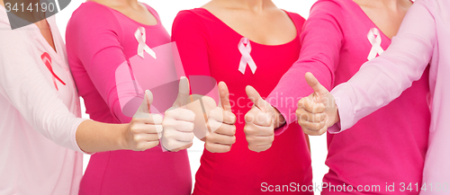 Image of close up of women with cancer awareness ribbons