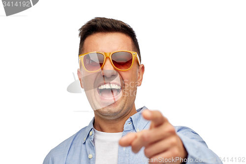 Image of face of smiling man in shirt and sunglasses