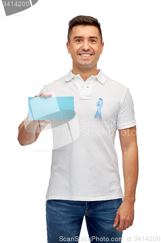 Image of man with prostate cancer awareness ribbon and card