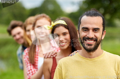 Image of group of smiling friends outdoors