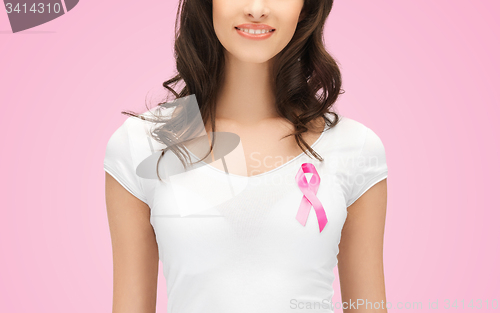 Image of smiling young woman with cancer awareness ribbon