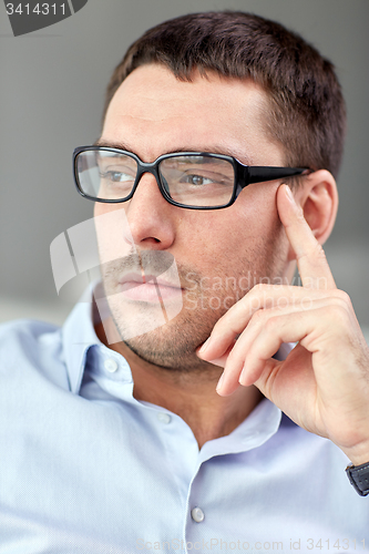 Image of portrait of  businessman in eyeglasses at office