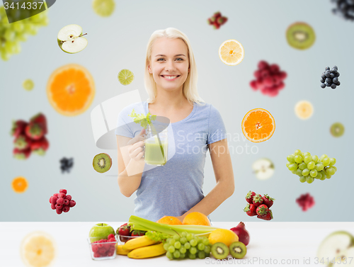 Image of smiling woman drinking juice or shake at home