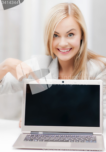 Image of businesswoman with laptop computer