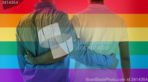 Image of close up of happy male gay couple hugging