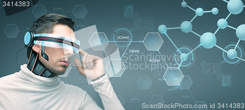 Image of man with futuristic 3d glasses and sensors