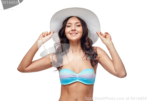 Image of happy young woman in bikini swimsuit and sun hat