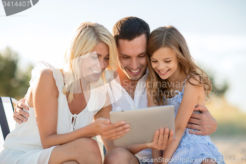 Image of happy family with tablet pc taking picture