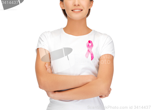 Image of smiling woman with pink cancer awareness ribbon