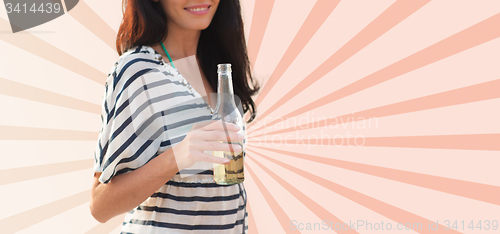 Image of close up of smiling young woman drinking