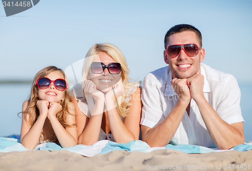 Image of happy family on the beach