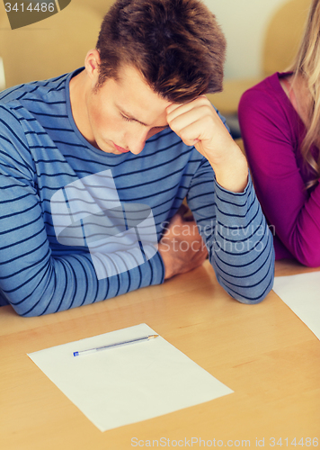 Image of group of students with papers