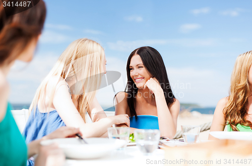 Image of girls in cafe on the beach