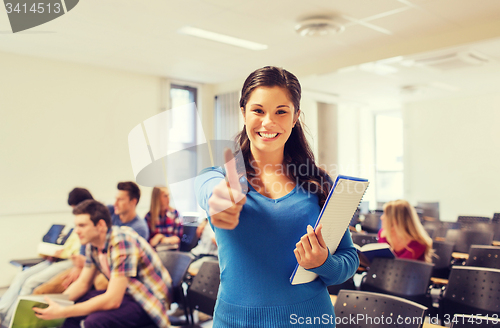 Image of group of smiling students in lecture hall