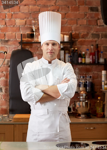 Image of happy male chef cook in restaurant kitchen