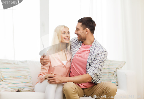 Image of smiling happy couple at home