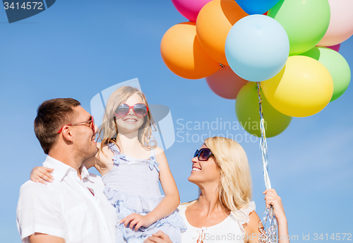 Image of family with colorful balloons