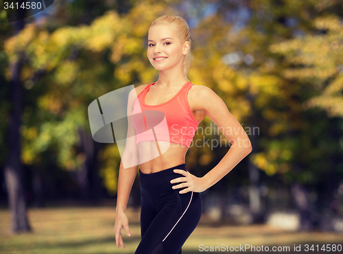 Image of beautiful athletic woman in sportswear