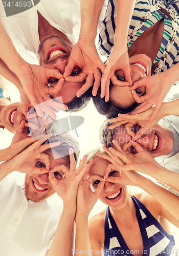 Image of smiling friends in circle