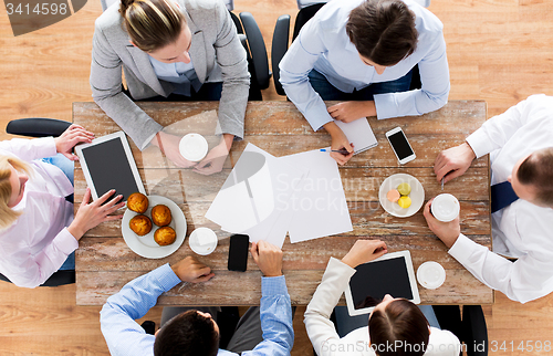 Image of close up of business team drinking coffee on lunch