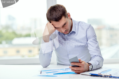 Image of close up of businessman with smartphone