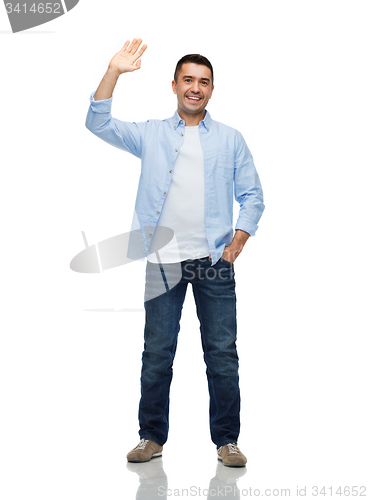 Image of smiling man waving hand