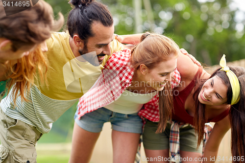 Image of group of smiling friends outdoors