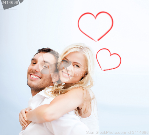 Image of couple having fun on the beach