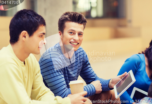 Image of group of students with tablet pc and coffee cup