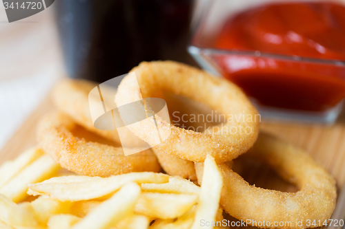 Image of close up of fast food snacks and drink on table