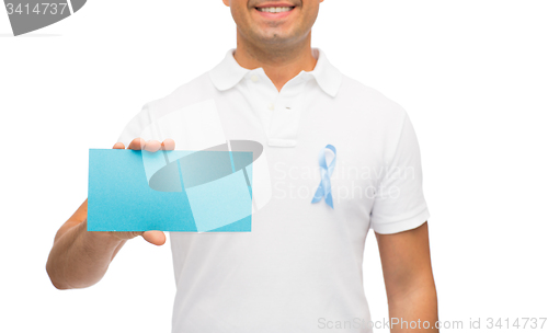 Image of man with prostate cancer awareness ribbon and card