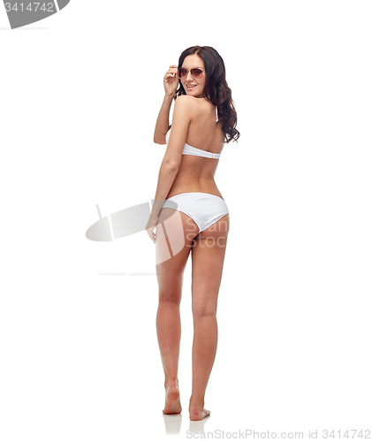 Image of happy woman in sunglasses and bikini swimsuit