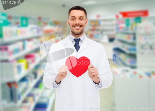 Image of male pharmacist with heart at drugstore