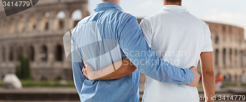 Image of close up of male gay couple over coliseum in rome