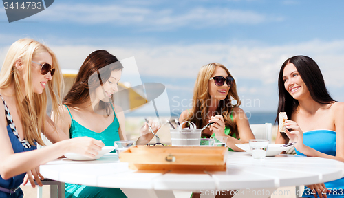 Image of girls in cafe on the beach