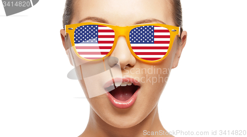 Image of surprised girl in sunglasses with american flag