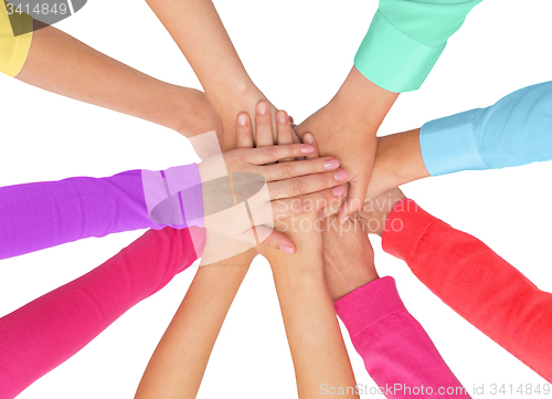 Image of close up of women hands on top in rainbow clothes